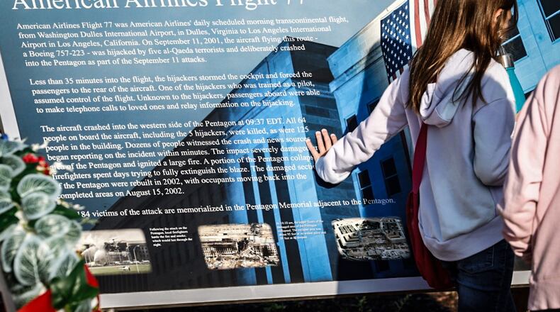 Nearly 100 people gathered at the Beavercreek 911 Memorial Monday September 11, 2023 for a remembrance ceremony honoring the thousands who died 22 years ago. JIM NOELKER/STAFF