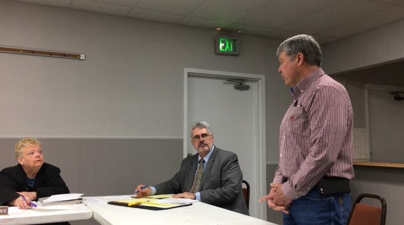 Bath Twp. Trustee Tom Pitstick (far right) testifying before the Bath Twp. Board of Zoning Appeals in March. Residents have started a petition to ask trustees Pitstick and Steve Ross to resign. STAFF/BONNIE MEIBERS