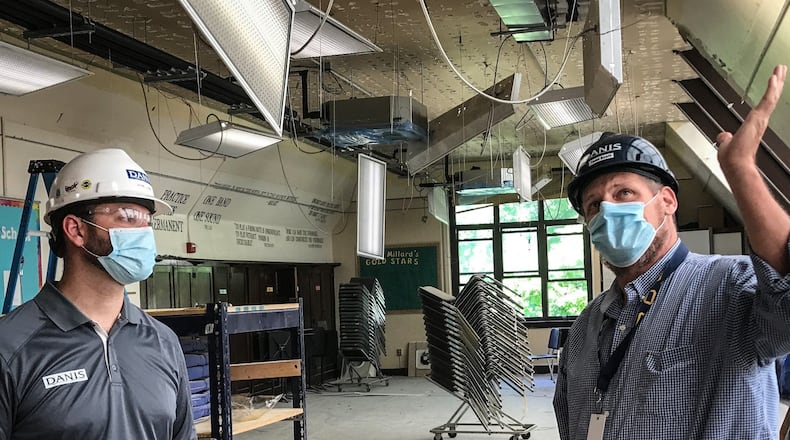 Gerred Laake, left, Project Manager and Todd Scott Operations Coordinator for Danis Construction said that most of the renovations inside will be HVAC and lighting. JIM NOELKER/STAFF