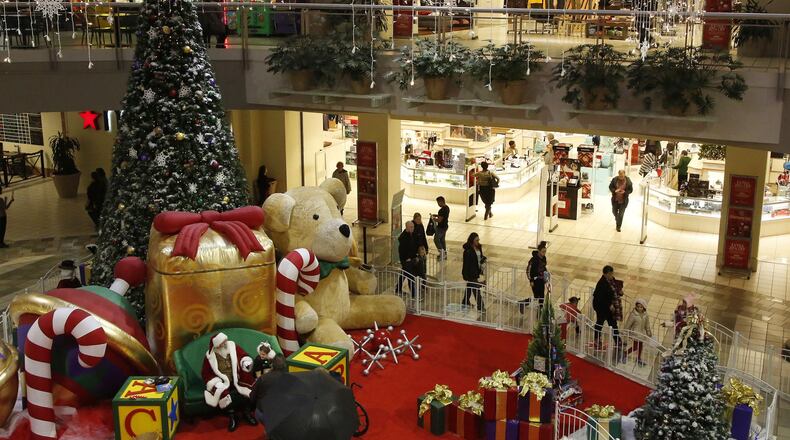 Local malls and retailers are expecting a huge turnout this weekend, just days before Christmas. This scene shows a busy evening at the Dayton Mall on Thursday. TY GREENLEES / STAFF