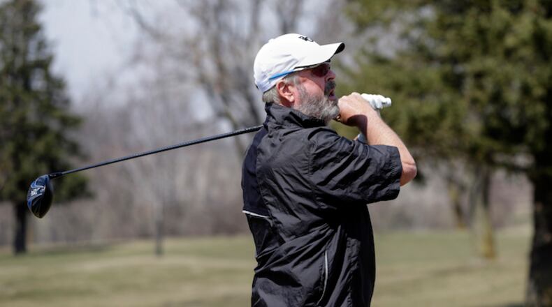 HOLD FOR STORY BY ERIC OLSON- In this April 5, 2018 photo, Bellevue University golf team member Don Byers follows the ball he hit during practice at the Platteview Golf Club in Bellevue, Neb. 61-year-old Byers is the oldest athlete in the NAIA since Alan Moore kicked an extra point for Faulkner University of Alabama when he was 61 in 2011. (AP Photo/Nati Harnik)