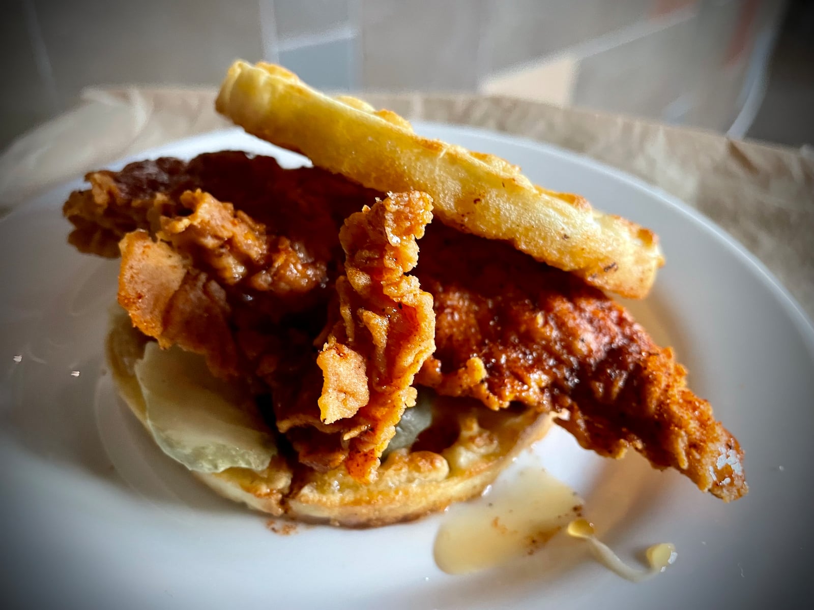 CMX CinéBistro at the Liberty Center has launched a new menu offering elevated theater food and snacks. Pictured is the Nashville hot chicken & waffles. NATALIE JONES/STAFF