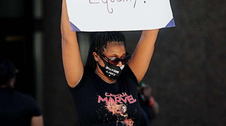 Hundreds of people have gathered for the first of two planned protest rallies today in Dayton. The event at the Walter H. Rice Federal Building calls for justice for George Floyd, who died in police custody in Minneapolis; Ahmaud Arbery, an unarmed black jogger who was shot and killed by pursuers in Georgia; and other victims of police and racial violence, said Donald Domineck, the chair of Dayton Ohio Chapter of the New Black Panther Party. Today's rally is supposed to bring the community together and provide a forum for people to vent, speak up and express how they feel, he said.
Photos by Marshall Gorby