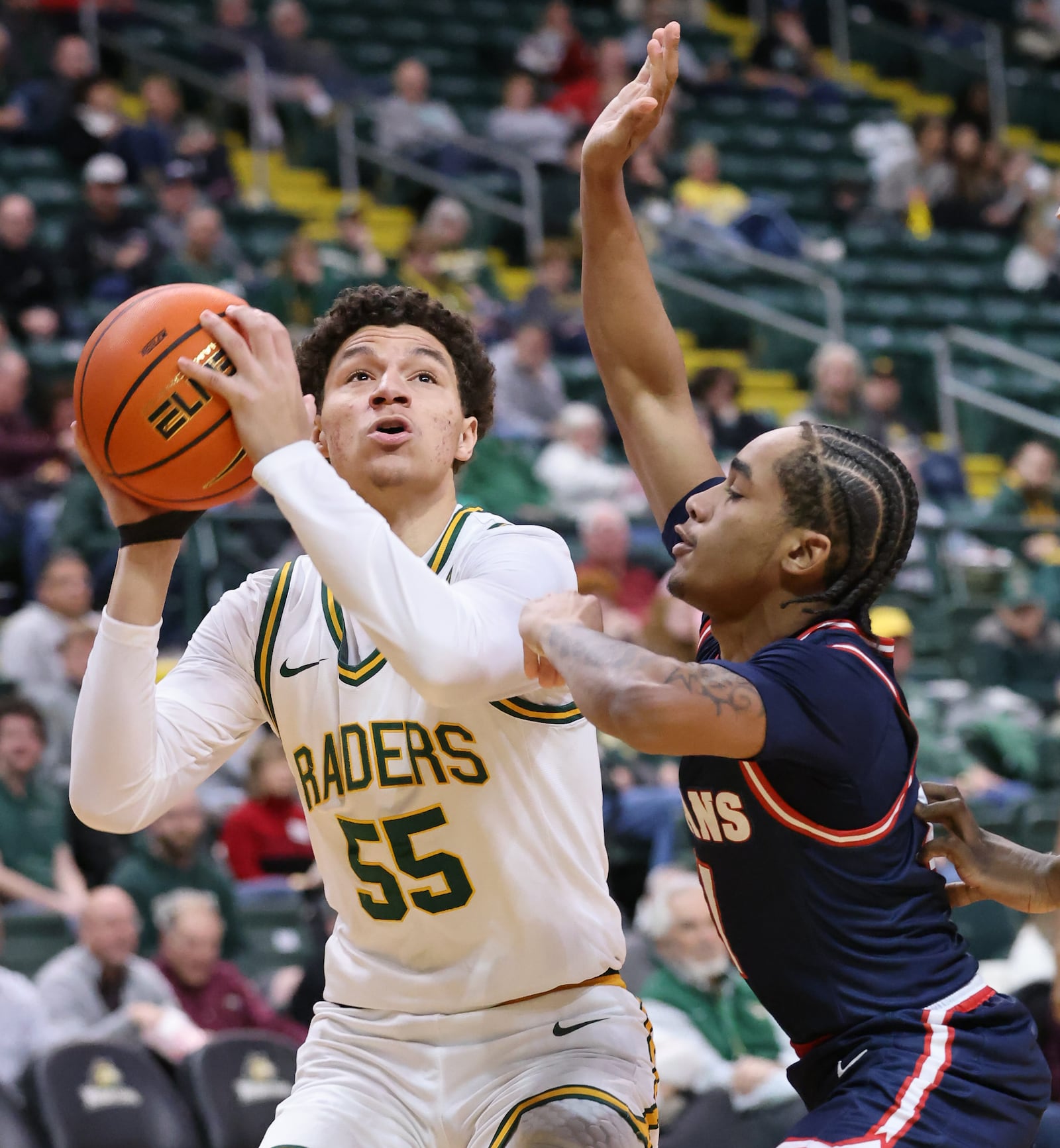Wright State freshman guard Michael Cooper shoots during the first half of a Horizon League game against Detroit Mercy on Thursday, Feb. 12. Cooper scored 15 points, including three consecutive 3-pointers in the second half. BRYANT BILLING / STAFF