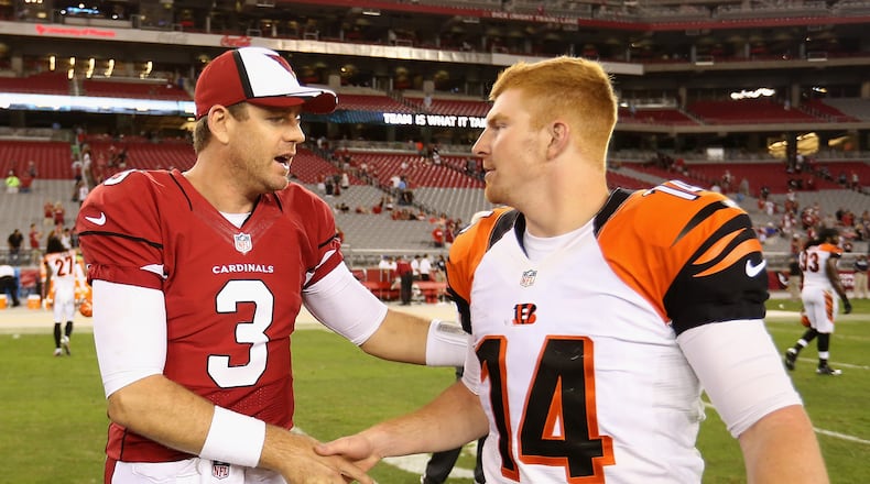 GLENDALE, AZ - AUGUST 24:  Quarterback Carson Palmer #3 of the Arizona Cardinals talks with quarterback Andy Dalton #14 of the Cincinnati Bengals following the preseason NFL game at the University of Phoenix Stadium on August 24, 2014 in Glendale, Arizona.  (Photo by Christian Petersen/Getty Images)
