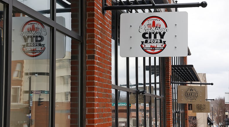 The sign for Champion City Pops has gone up at the vacant space next to Charlo's along South Fountain Avenue in downtown Springfield. BILL LACKEY/STAFF