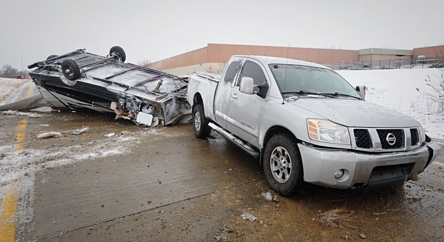 I-70 west ramp closes after trailer rolls over due to slick roads