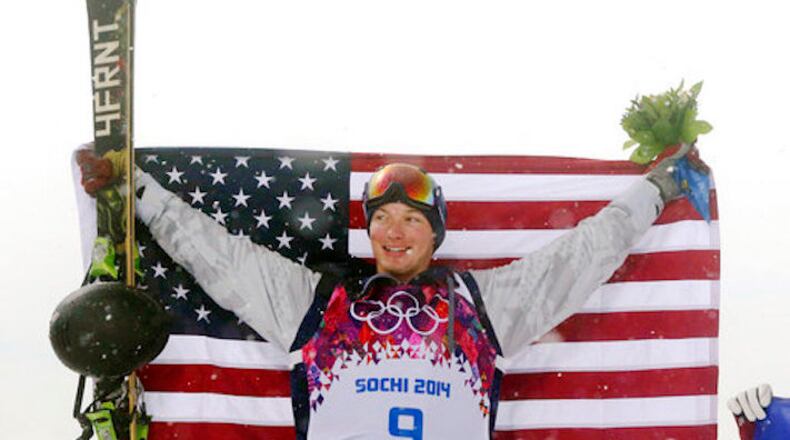 Gold medalist David Wise of the United States celebrates after the men's ski halfpipe final at the Rosa Khutor Extreme Park, at the 2014 Winter Olympics, Tuesday, Feb. 18, 2014, in Krasnaya Polyana, Russia. (AP Photo/Sergei Grits)