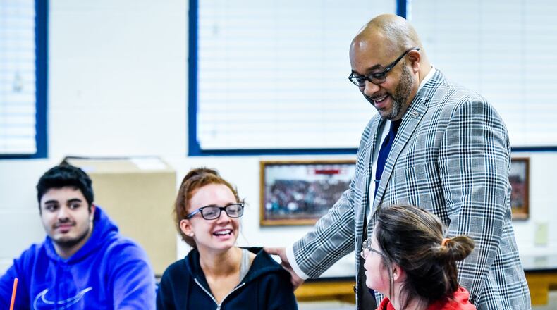 Lakota West High School principal G. Elgin Card talks to students in a physics class at the school Monday, Feb. 12 in West Chester Township. NICK GRAHAM/STAFF