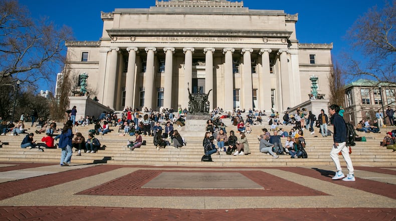 FILE - Students relax on the front steps of Low Memorial Library on the Columbia University campus, in New York City, Feb. 10, 2023. (AP Photo/Ted Shaffrey, File)