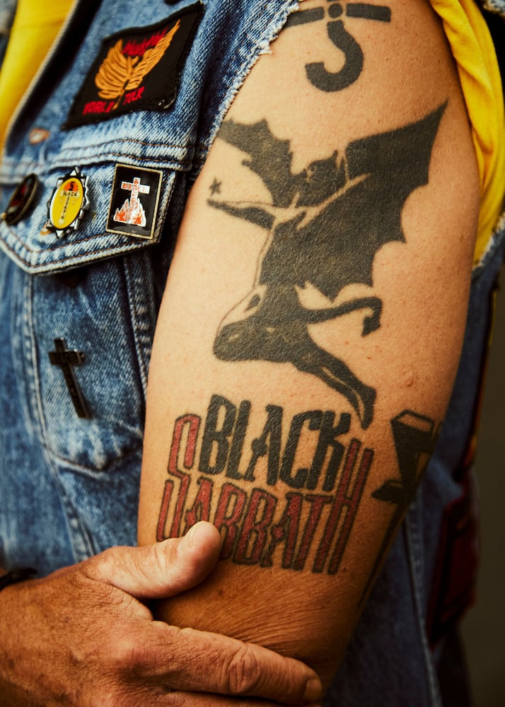 A fan outside Villa Park soccer stadium ahead of a Black Sabbath reunion concert that was billed as the last for their now 75-year-old lead singer Ozzy Osbourne, in Birmingham, England, July 5, 2025. (Ellie Smith/The New York Times)