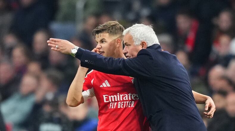 Benfica's head coach Jose Mourinho gives instructions to Benfica's Samuel Dahl during the Champions League opening phase soccer match between Ajax and SL Benfica in Amsterdam, Netherlands, Tuesday, Nov. 25, 2025. (AP Photo/Peter Dejong)