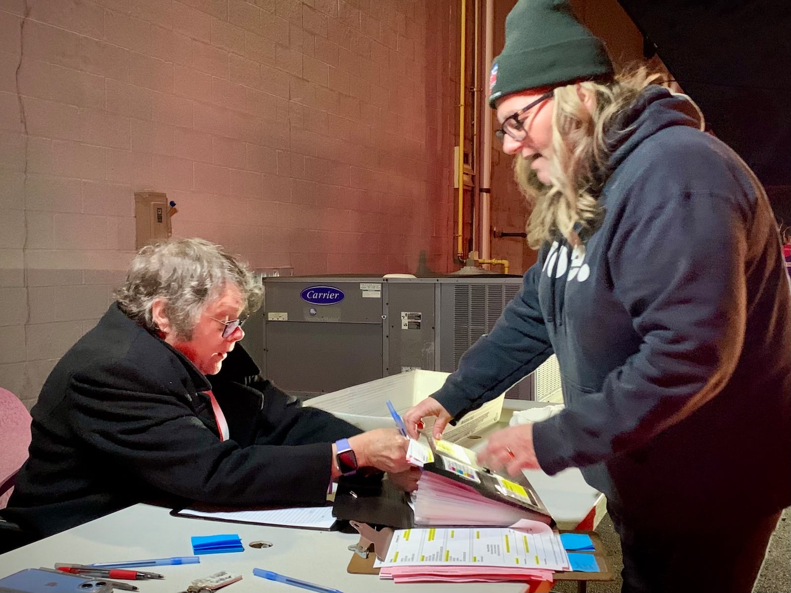 Staff with the Greene County Board of Elections sort and count voting machine USBs as precinct workers return their materials, Nov. 4, 2025. LONDON BISHOP/STAFF
