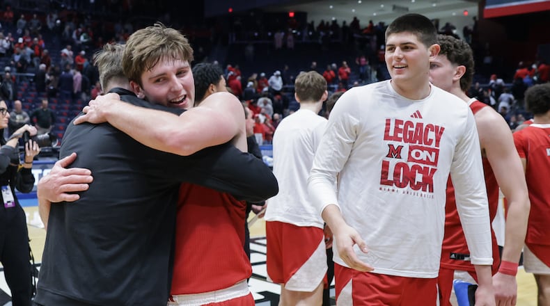 Miami University senior guard Peter Suder (left) following an 89-79 win over Southern Methodist in an NCAA First Four game on Wednesday, March 18 at University of Dayton Arena. BRYANT BILLING / STAFF