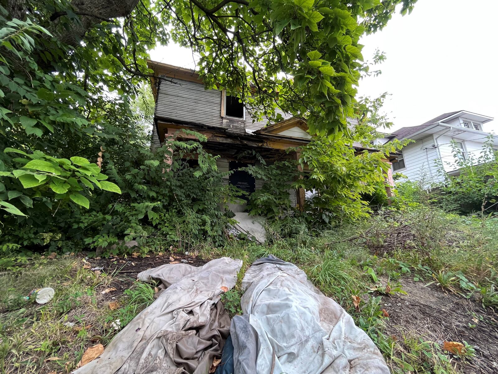 A fire-damaged home in West Dayton that was slated for demolition. CORNELIUS FROLIK / STAFF