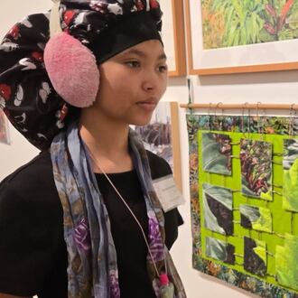 Kaydence Denson looks over her artwork as one of 10 artists who will be celebrated with a special event on Thursday, Nov. 6 at the Springfield Museum of Art. CONTRIBUTED