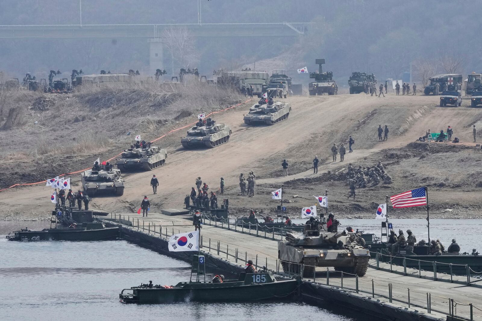 FILE - A South Korean army K1E1 tank crosses a floating bridge on the Imjin River during a joint river-crossing exercise between South Korea and the United States as a part of the Freedom Shield military exercise in Yeoncheon, South Korea, on March 20, 2025. (AP Photo/Ahn Young-joon, File)