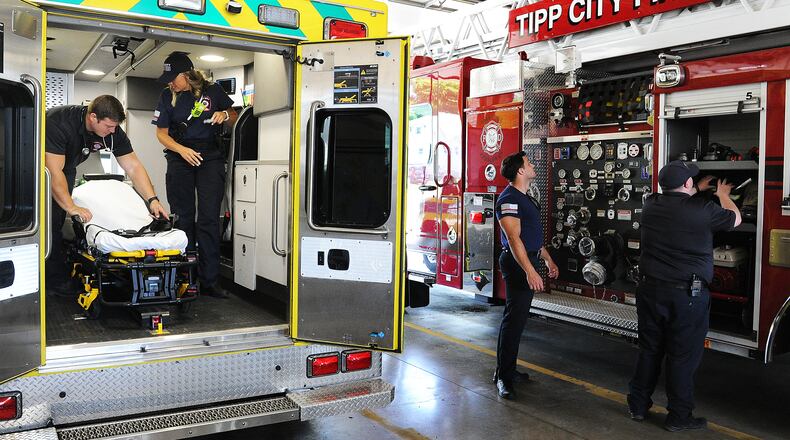 Members of the Tipp City Fire Department check their equipment and gear Thursday July 22, 2022. MARSHALL GORBY\STAFF