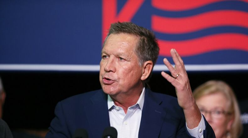 Republican presidential candidate Ohio Gov. John Kasich speaks to supporters during a rally at Everal Barn & Homestead in Westerville, Ohio, Tuesday, Oct. 27, 2015. Kasich plans to attend the third Republican presidential debate that takes place Wednesday night in Boulder, Colo. (Kyle Robertson/The Columbus Dispatch via AP) MANDATORY CREDIT