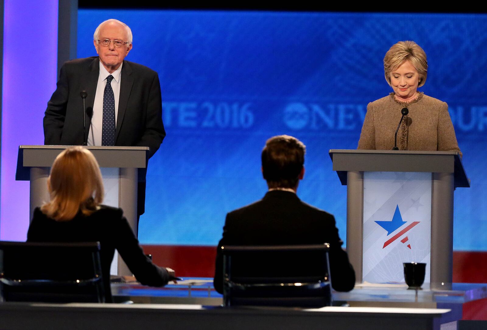 MANCHESTER, NH - DECEMBER 19: Democratic president candidates Bernie Sanders and Hillary Clinton takes the stage for the debate at Saint Anselm College December 19, 2015 in Manchester, New Hampshire. This is the third democratic debate. (Photo by Andrew Burton/Getty Images)