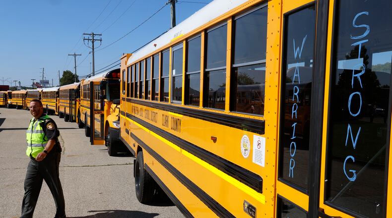 The Fellowship Christian Church was surrounded by 37 school buses Monday, August 28, 2023 during the funeral for 11-year-old Aiden Clark, who was killed in a fatal Northwestern school bus crash last week. BILL LACKEY/STAFF