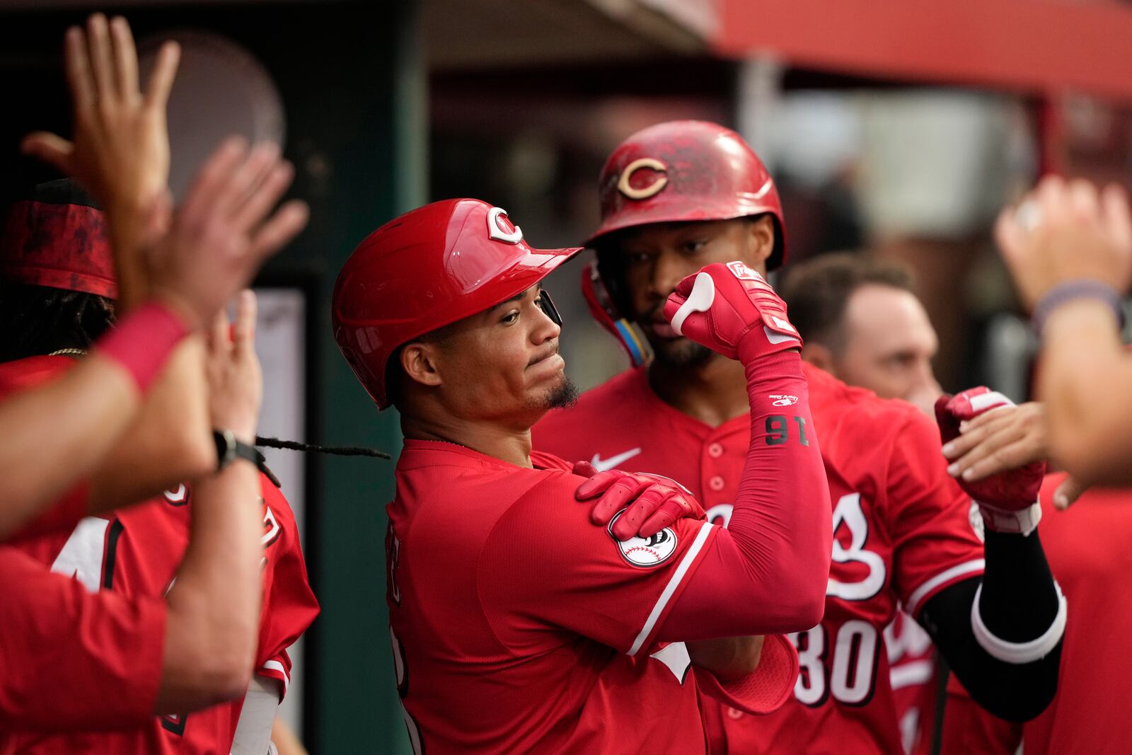 Cincinnati Reds' Noelvi Marte celebrates in the dugout after hitting a two-run homer during the fourth inning of a baseball game against the Miami Marlins in Cincinnati, Wednesday, July 9, 2025. (AP Photo/Carolyn Kaster)