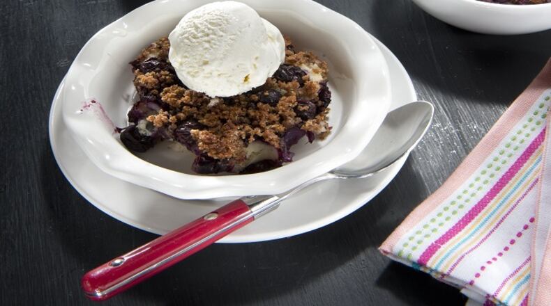 Try Lemon Blueberry Brown Betty topped with a scoop of frozen nonfat yogurt ice. (Tammy Ljungblad/Kansas City Star/TNS)