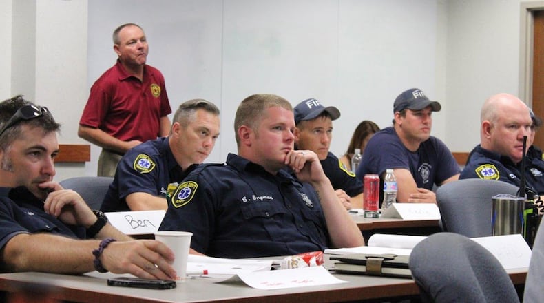 The Wright-Patterson Air Force Base fire department employs about 80 staff members comprised of firefighters, inspectors, paramedics and dispatchers, assigned at one of the three fire stations on the installation. Ensuring emergency response time is quick, two fire stations are located in Area A and one in Area B. Along with responding to on-base incidents, the fire department also provides assistance to local fire departments under a mutual aid agreement. Fire department personnel attended a post-traumatic stress disorder/peer supportprogram training June 6 to learn how to be a peer supporter for their counterparts when that person may not want to talk to the typical outlets such as a chaplain or supervisor. (U.S. Air Force photo/Stacey Geiger)