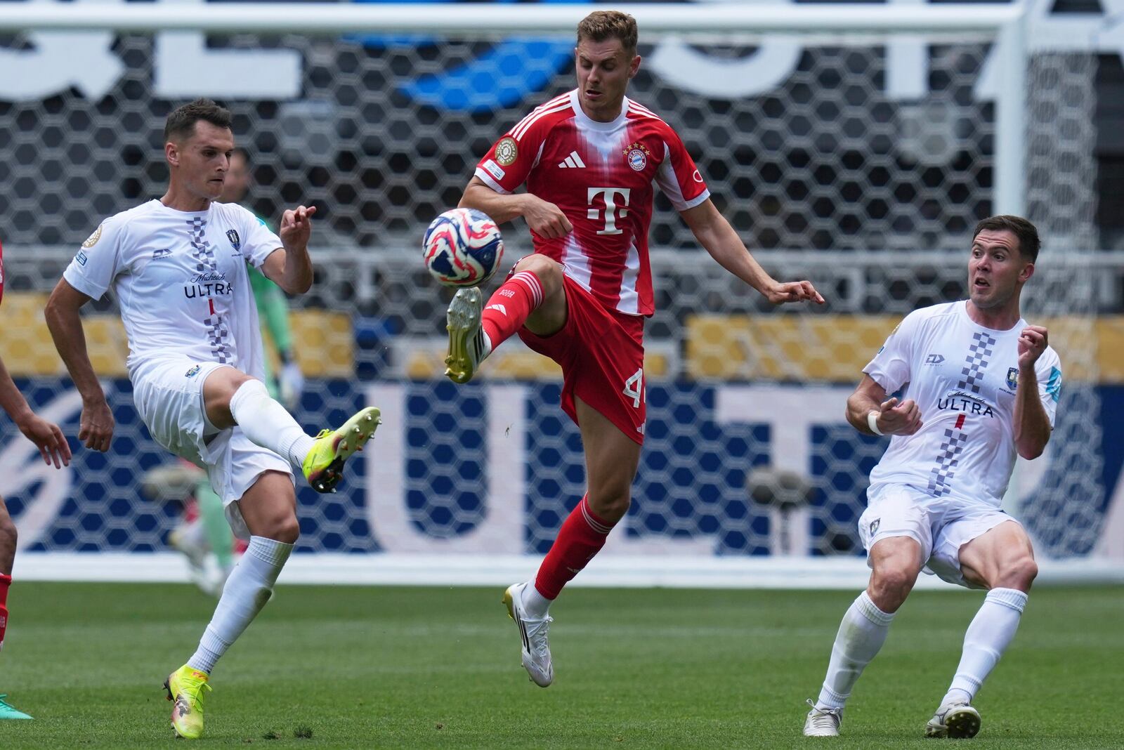 Bayern Munich's Josip Stanisic, center, controls the ball during the Club World Cup group C soccer match between Bayern Munich and Auckland City in Cincinnati, Sunday, June 15, 2025. (AP Photo/Joshua A. Bickel)