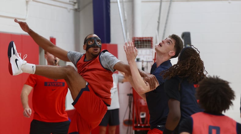 Dayton's Zed Key, left, and Amaël L'Etang battle for a rebound during a preseason practice on Wednesday, Oct. 2, 2024, at the Cronin Center. David Jablonski/Staff
