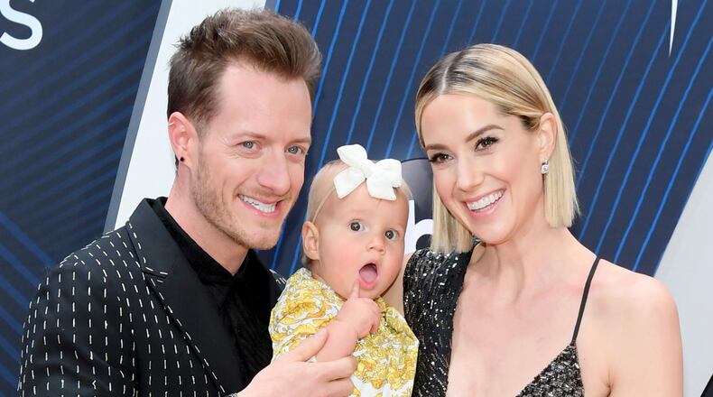 NASHVILLE, TN - NOVEMBER 14: (FOR EDITORIAL USE ONLY) Tyler Hubbard of musical duo Florida Georgia Line, daughter and Hayley Hubbard attend the 52nd annual CMA Awards at the Bridgestone Arena on November 14, 2018 in Nashville, Tennessee. (Photo by Jason Kempin/Getty Images)