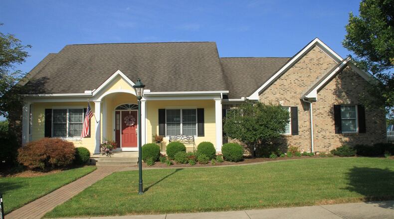 The home has about 4,120 sq. ft. of living space, including the lower level. The home is along a common walking trail and greenspace. The property has an oversized 2-car, side-entry garage with extra parking pad. CONTRIBUTED PHOTOS BY KATHY TYLER