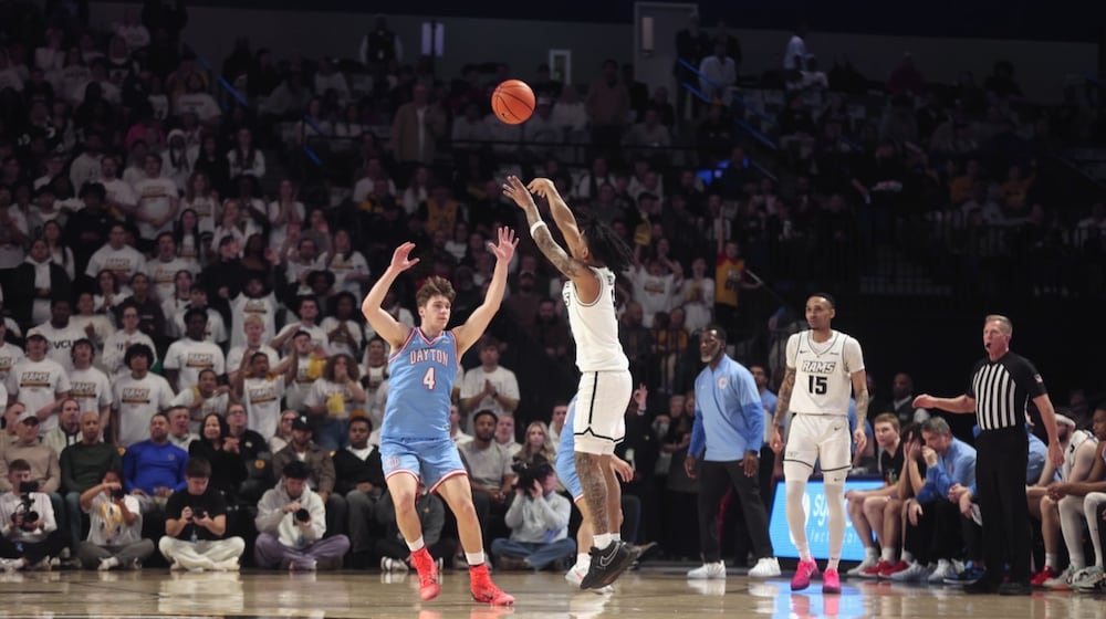 Virginia Commonwealth's Terrence Hill Jr., makes a 3-pointer against Dayon in the first half on Friday, Feb. 6, 2026, at the Siegel Center in Richmond, Va. David Jablonski/Staff