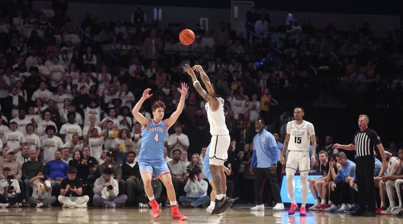 Virginia Commonwealth's Terrence Hill Jr., makes a 3-pointer against Dayon in the first half on Friday, Feb. 6, 2026, at the Siegel Center in Richmond, Va. David Jablonski/Staff