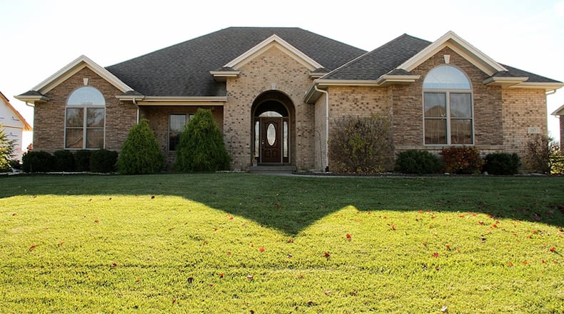 The brick-and-stone ranch has a full, finished basement that includes a recreation room, bonus room and full bathroom. CONTRIBUTED PHOTOS BY KATHY TYLER