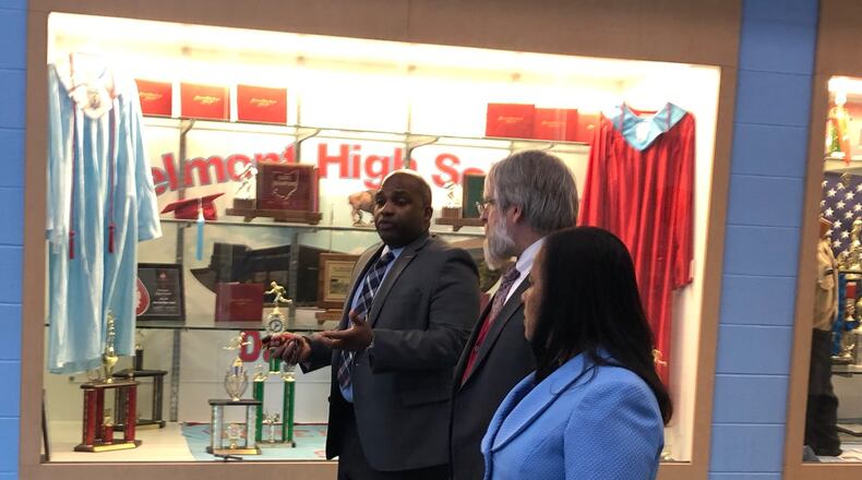 Belmont High School Principal Donetrus Hill (left) leads a tour of the school for state Superintendent Paolo DeMaria and Dayton Public Schools Treasurer Hiwot Abraha. DeMaria toured several Dayton schools on Tuesday, Feb. 26, 2019. JEREMY P. KELLEY / STAFF