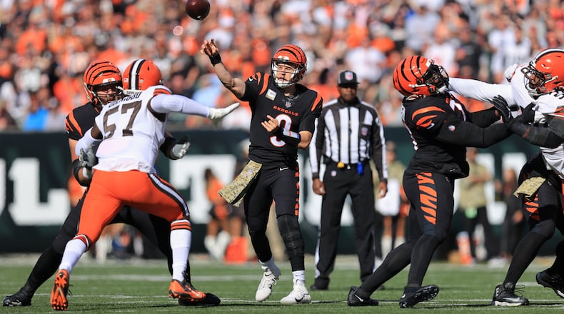 Cincinnati Bengals quarterback Joe Burrow (9) throws during the first half of an NFL football game against the Cleveland Browns, Sunday, Nov. 7, 2021, in Cincinnati. (AP Photo/Aaron Doster)