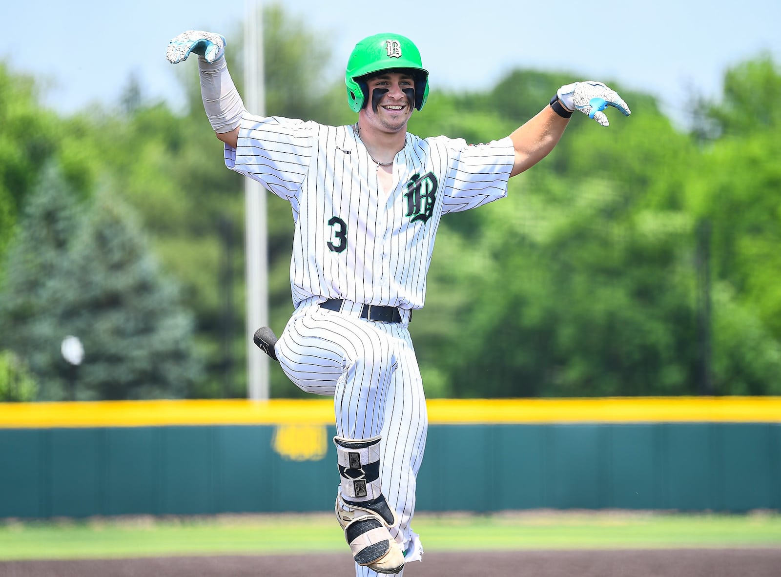 Badin senior Kade Bowling celebrates after hitting a triple during a recent tournament game. KYLE HENDRIX / CONTRIBUTED