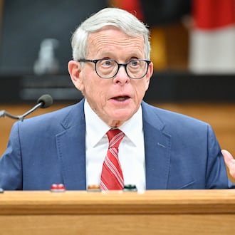 Gov. Mike DeWine (right) speaks during a news conference on Monday, Dec. 1 at Dayton City Commission Office. BRYANT BILLING/STAFF