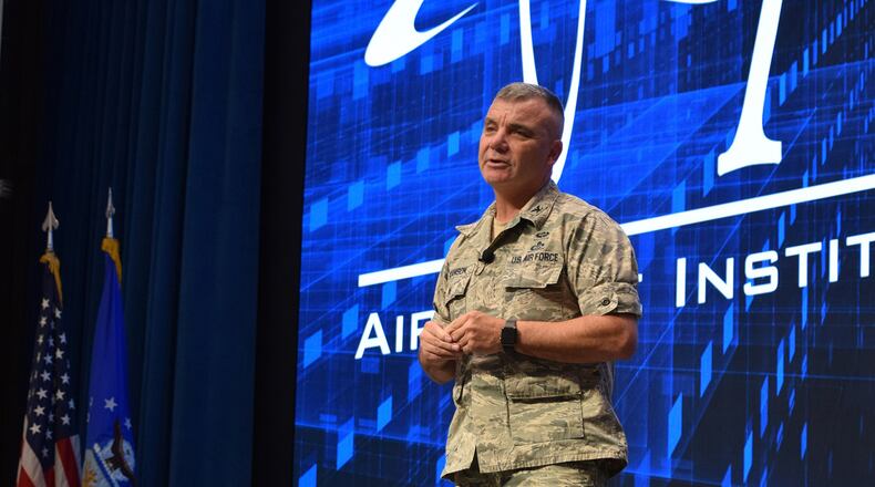 Retired Col. Robert Swanson Jr. speaks in front of hundreds of graduate students and faculty Jan. 16 at the Air Force Institute of Technology at Wright-Patterson Air Force Base. Swanson is a suicide attempt survivor and shared his insights on recovery and getting mental health help. (U.S. Air Force photo/Katie Scott)
