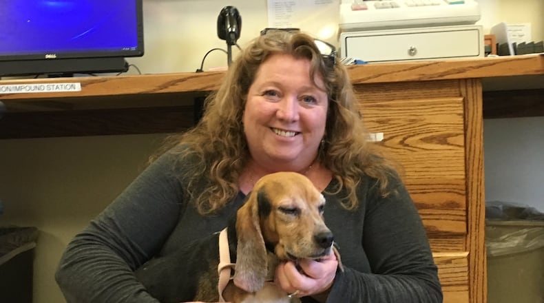 Julie Holmes-Taylor, director at Greene County Animal Care and Control, holds a recent stray that came into the facility on Dayton-Xenia Road. RICHARD WILSON/STAFF