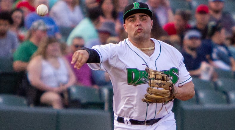 Dragons third baseman Sal Stewart throws out a runner at first during Tuesday night's game against Lansing at Day Air Ballpark. Jeff Gilbert/CONTRIBUTED