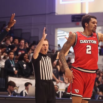 Dayton's De'Shayne Montgomery reacts after making a 3-pointer in the second half against George Washington on Friday, Feb. 27, 2026, at the Charles E. Smith Center in Washington, D.C. David Jablonski/Staff