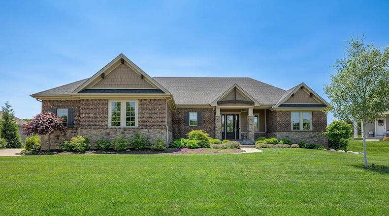 This brick and stone ranch home in Wayne Township sits on a nearly an acre lot in Creekview Estates.