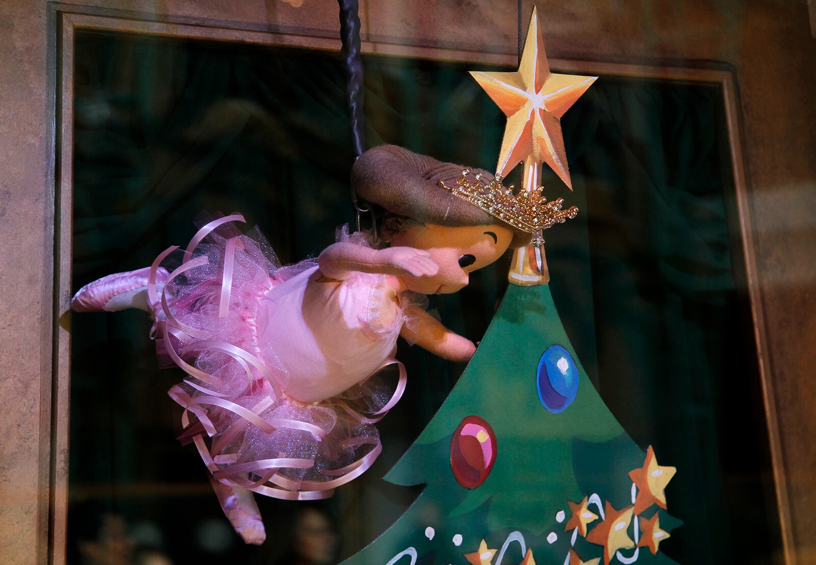 A ballerina ascends with a growing Christmas tree within a new display of the Rike's Wonderland Window boxes at the Schuster Center in downtown Dayton. LISA POWELL / STAFF