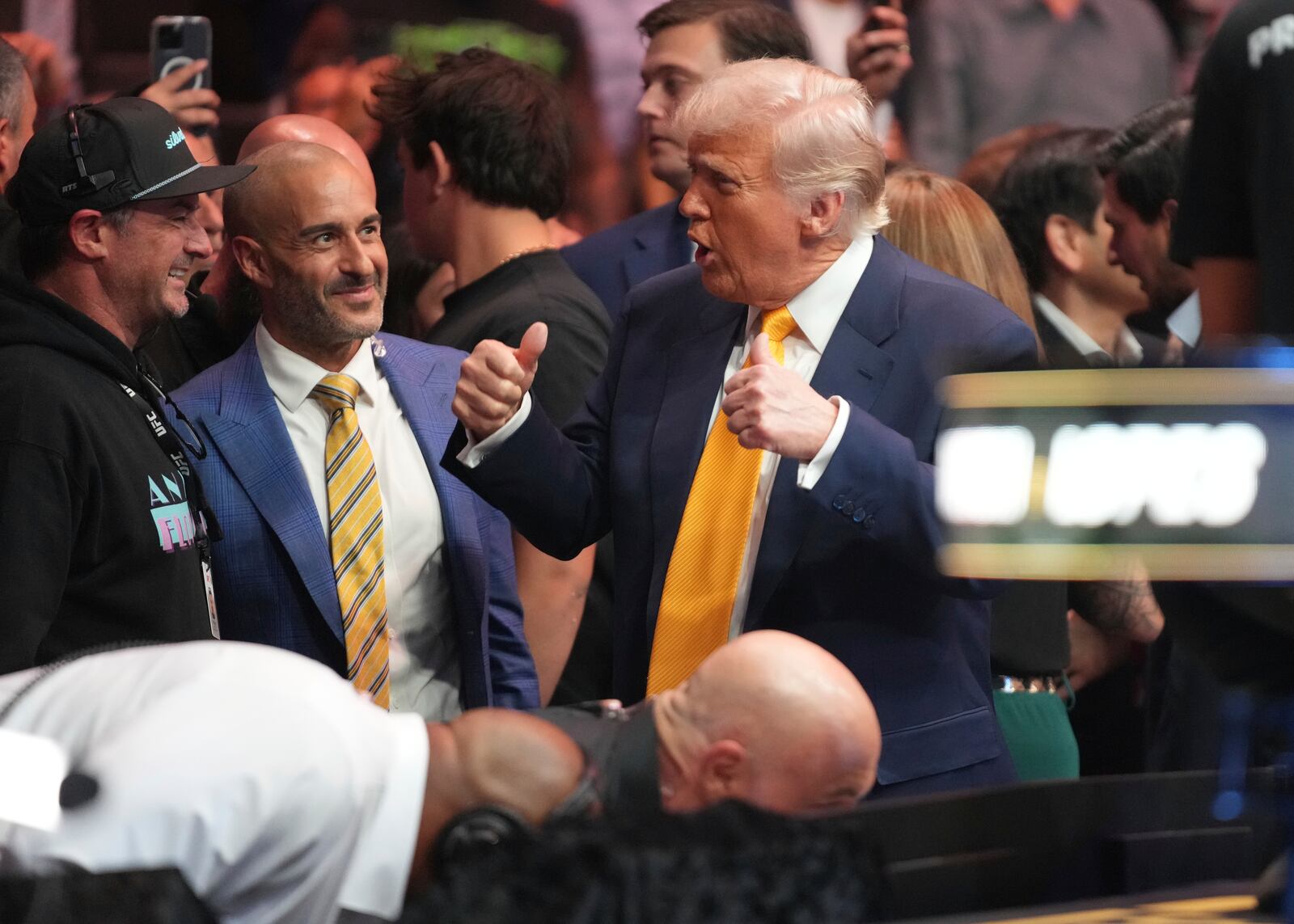 President Donald Trump gives a thumbs up as he attends a mixed martial arts fight at UFC 314, Saturday, April 12, 2025, in Miami. (AP Photo/Lynne Sladky)