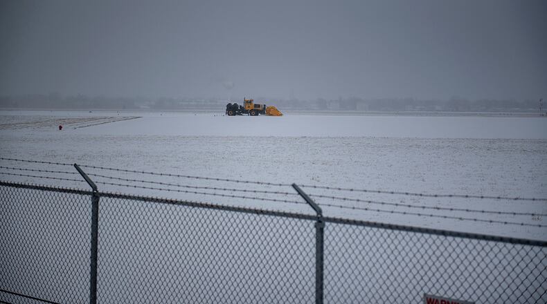 An 88th Civil Engineer Squadron plow operator clears snow off the flightline in February last year at Wright-Patterson Air Force Base. U.S. AIR FORCE PHOTO/SENIOR AIRMAN JACK GARDNER