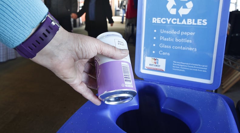 Recycling bins at the 2nd Street Public Market in Dayton were obtained in part with a recycling incentive grant from the Montgomery County Solid Waste District. CHRIS STEWART / STAFF