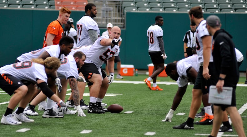 Cincinnati Bengals rookie center Billy Price makes a line call during Tuesday’s first day of mandatory minicamp at Paul Brown Stadium. JAY MORRISON/STAFF