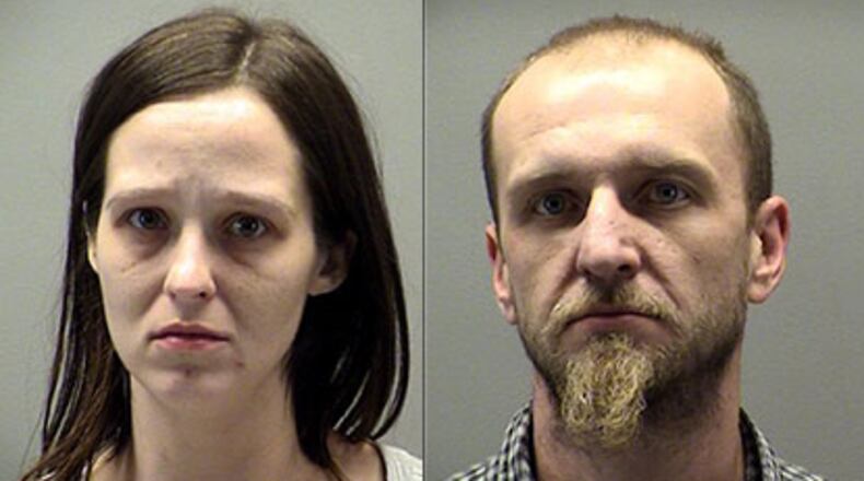Jeanette and Bobby Dale Davis were taken into police custody on drug and child endangerment charges after Dayton police officers located heroin and an infant in their van.